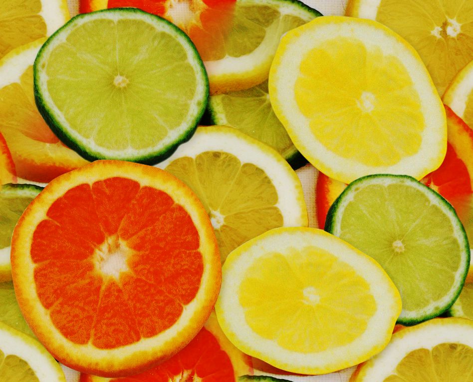 Very large orange, lemon and lime slices seamless web background or wallpaper
