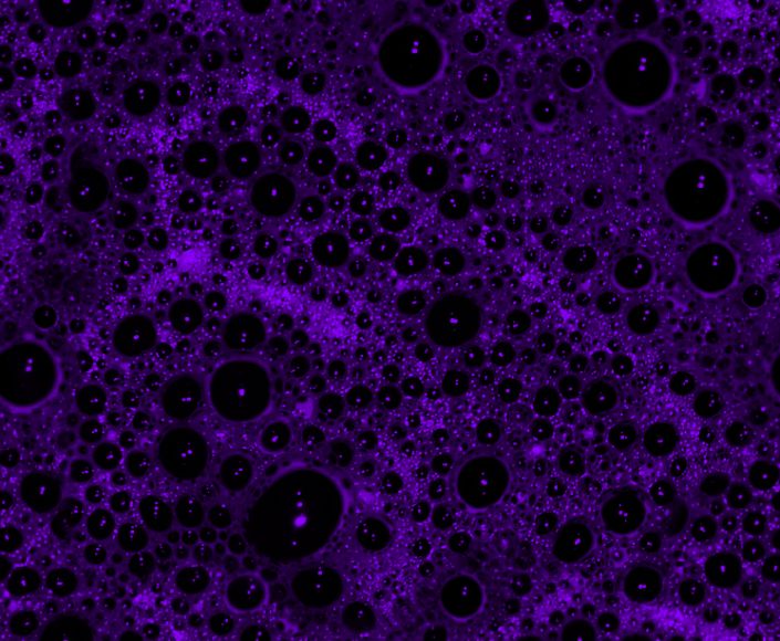 Ultraviolet or possibly deep purple seamless repeating background image of bubbles